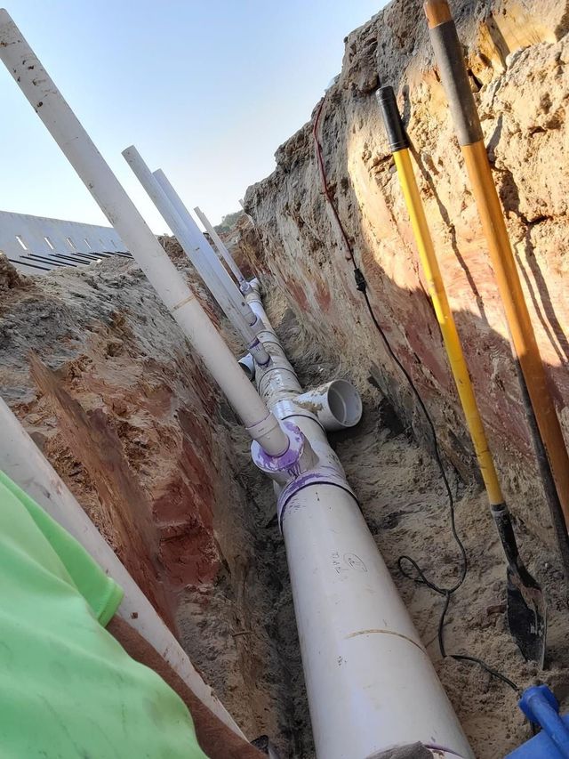 Plumbing lines installed in a deep soil trench
